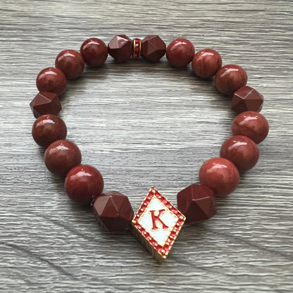 Kappa Alpha Psi fraternity exclusive Glass Beaded Bracelet on elastic stretch rope; simple and elegant. Easy bracelet to slide on and off wrist. The color of amber beads may vary from bracelet to bracelet due to each bracelet being hand made from natural materials with a personal touch.