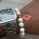 Kappa Alpha Psi fraternity exclusive Glass Beaded Bracelet on elastic stretch rope; simple and elegant. Easy bracelet to slide on and off wrist. The color of amber beads may vary from bracelet to bracelet due to each bracelet being hand made from natural materials with a personal touch.