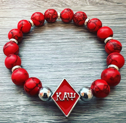 Kappa Alpha Psi fraternity exclusive Glass Beaded Bracelet on elastic stretch rope; simple and elegant. Easy bracelet to slide on and off wrist. The color of amber beads may vary from bracelet to bracelet due to each bracelet being hand made from natural materials with a personal touch.