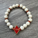 Kappa Alpha Psi fraternity exclusive Glass Beaded Bracelet on elastic stretch rope; simple and elegant. Easy bracelet to slide on and off wrist. The color of amber beads may vary from bracelet to bracelet due to each bracelet being hand made from natural materials with a personal touch.