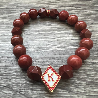 Kappa Alpha Psi fraternity exclusive Glass Beaded Bracelet on elastic stretch rope; simple and elegant. Easy bracelet to slide on and off wrist. The color of amber beads may vary from bracelet to bracelet due to each bracelet being hand made from natural materials with a personal touch.