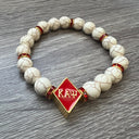 Kappa Alpha Psi fraternity exclusive Glass Beaded Bracelet on elastic stretch rope; simple and elegant. Easy bracelet to slide on and off wrist. The color of amber beads may vary from bracelet to bracelet due to each bracelet being hand made from natural materials with a personal touch.