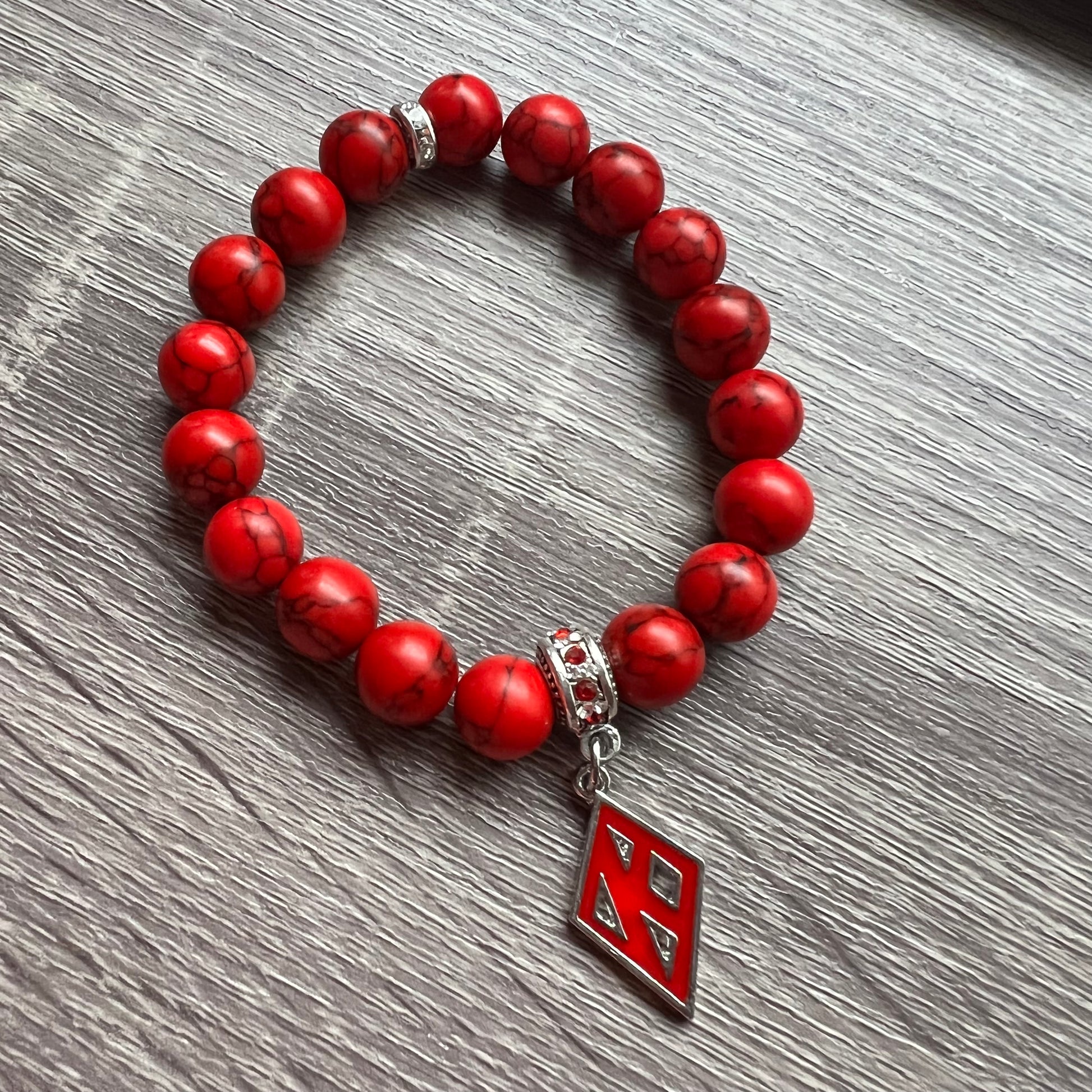 Kappa Alpha Psi fraternity exclusive Glass Beaded Bracelet on elastic stretch rope; simple and elegant. Easy bracelet to slide on and off wrist. The color of amber beads may vary from bracelet to bracelet due to each bracelet being hand made from natural materials with a personal touch.