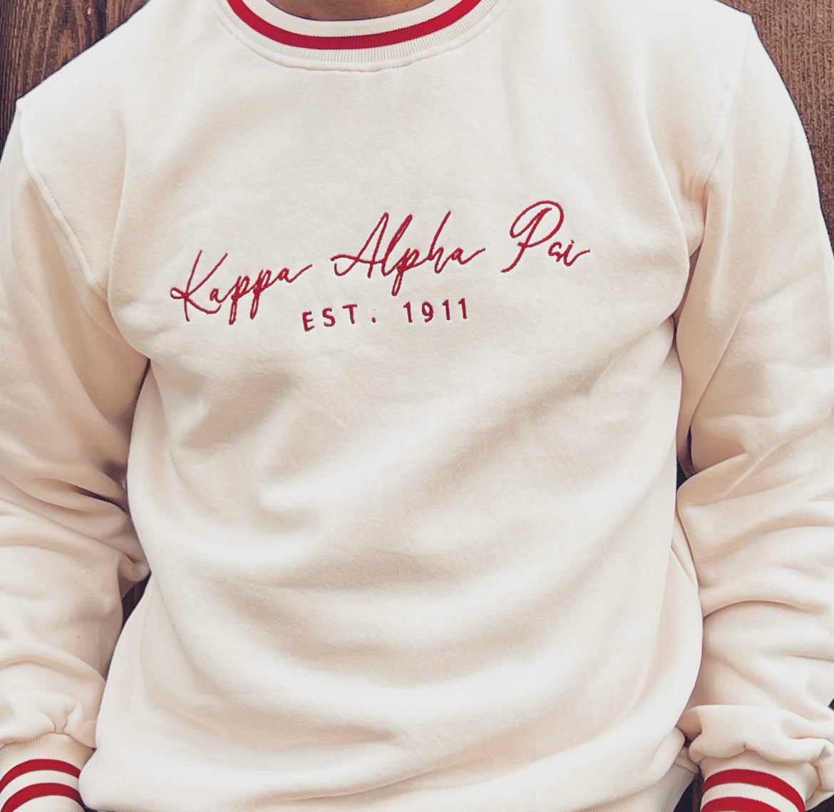 Exclusive Kappa Alpha Psi Well Stitched Appliqué Embroidery Lettered Sweater. This is the perfect long-sleeved Sweater to wear while showing off your Kappa Alpha Psi fraternity lettering. A comfortable 100% cotton tee with a twill Greek letters embroidery across the chest give you the perfect fit. This sweater is also a perfect gift for your favorite Kappa Man.