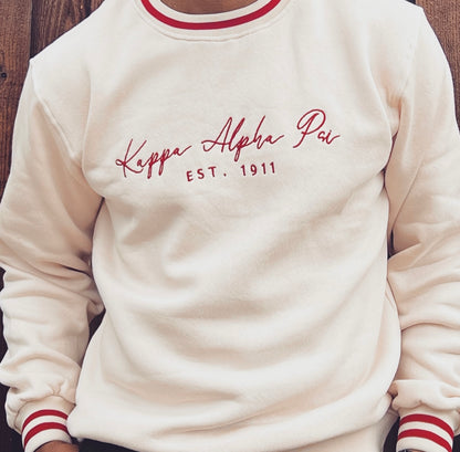 Exclusive Kappa Alpha Psi Well Stitched Appliqué Embroidery Lettered Sweater. This is the perfect long-sleeved Sweater to wear while showing off your Kappa Alpha Psi fraternity lettering. A comfortable 100% cotton tee with a twill Greek letters embroidery across the chest give you the perfect fit. This sweater is also a perfect gift for your favorite Kappa Man.